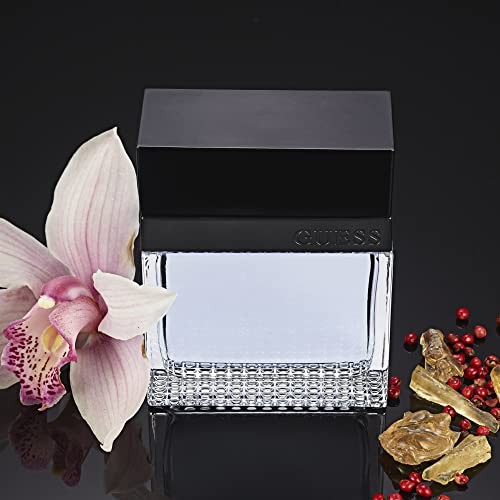 Guess Seductive Men/Homme Eau De Toilette 4 Piece Gift Set - Cologne Spray 3.4 Fl. Oz., Deodorizing Body Spray 6.0 Oz., Shower Gel 3.4 Fl. Oz., & Pouc